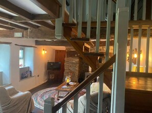 Cottage | Living room | Fireplace - Idlewild Animal Sanctuary Farmhouse Stay - Charity (Conwy)