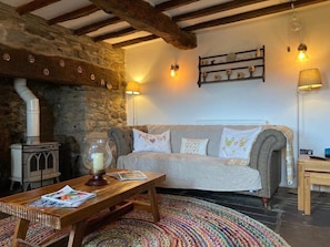 Cottage | Living area | Fireplace - Idlewild Animal Sanctuary Farmhouse Stay - Charity (Conwy)