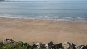 On the beach, sun-loungers