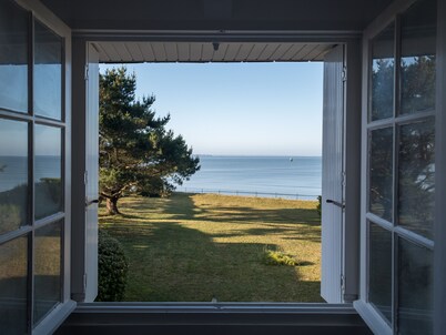 Family home with the ocean at the end of the garden.