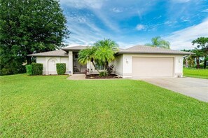 Stroll through the serene surroundings of this single-story home, complete with a garage and inviting front porch.