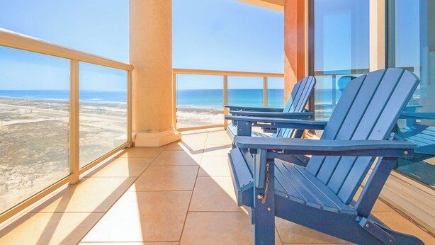 A balcony with a clear view of the ocean and a sandy beach. - Tower 3 @ Portofino Gulf to Bay Views- Sleeps 10! (Pensacola Beach)