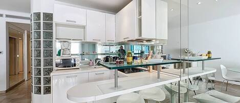 Fridge, dishwasher, coffee/tea maker, cookware/dishes/utensils