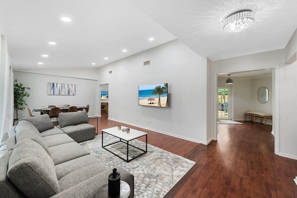 Spread out in the spacious layout of this Fort Lauderdale home, which offers 3 bedrooms & 2 full bathrooms, separate living area with a comfy sofa, a modern dining table, game room with ping pong & foosball tables, large kitchen with updated appliances and bar seating, TV's in all rooms, separate laundry room and contemporary touches throughout!
Stay with SoFlo Vacation Rental...