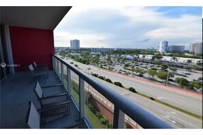 Enjoy the city view from this balcony with a clear view of the cityscape.
