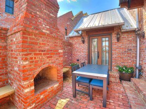 Outdoor dining - Tuscan feel with outdoor fireplace and cooking. (Carlton Landing)
