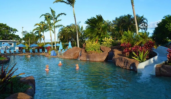 Relax by the pool surrounded by lush tropical vegetation and enjoy a refreshing swim or thrilling water slide.