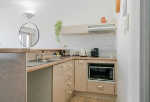 Fridge, microwave, stovetop, coffee/tea maker