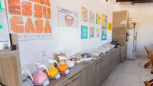 A breakfast bar with various food items and a refrigerator. - POUSADA SUMMER BEACH BY AFT (Ipojuca)