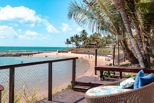 On the beach, white sand, sun loungers, beach umbrellas