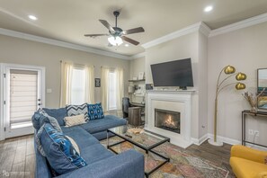 Smart TV, fireplace, books, printers