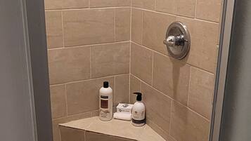 Shower, hair dryer, towels, toilet paper