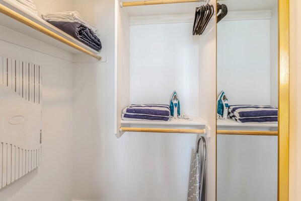 A bathroom with a mirror, towel racks, and a towel warmer. - Kasa Scottsdale Quarter Phoenix (Scottsdale)