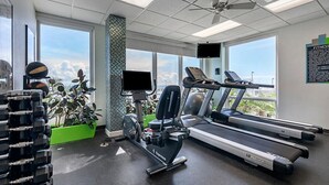 A gym with treadmills, dumbbells, and exercise balls. - Beautiful Daytona Beach Oceanfront 2 Bedroom Condo (Daytona Beach)