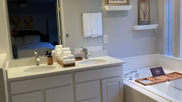 Combined shower/bathtub, hair dryer, towels, toilet paper