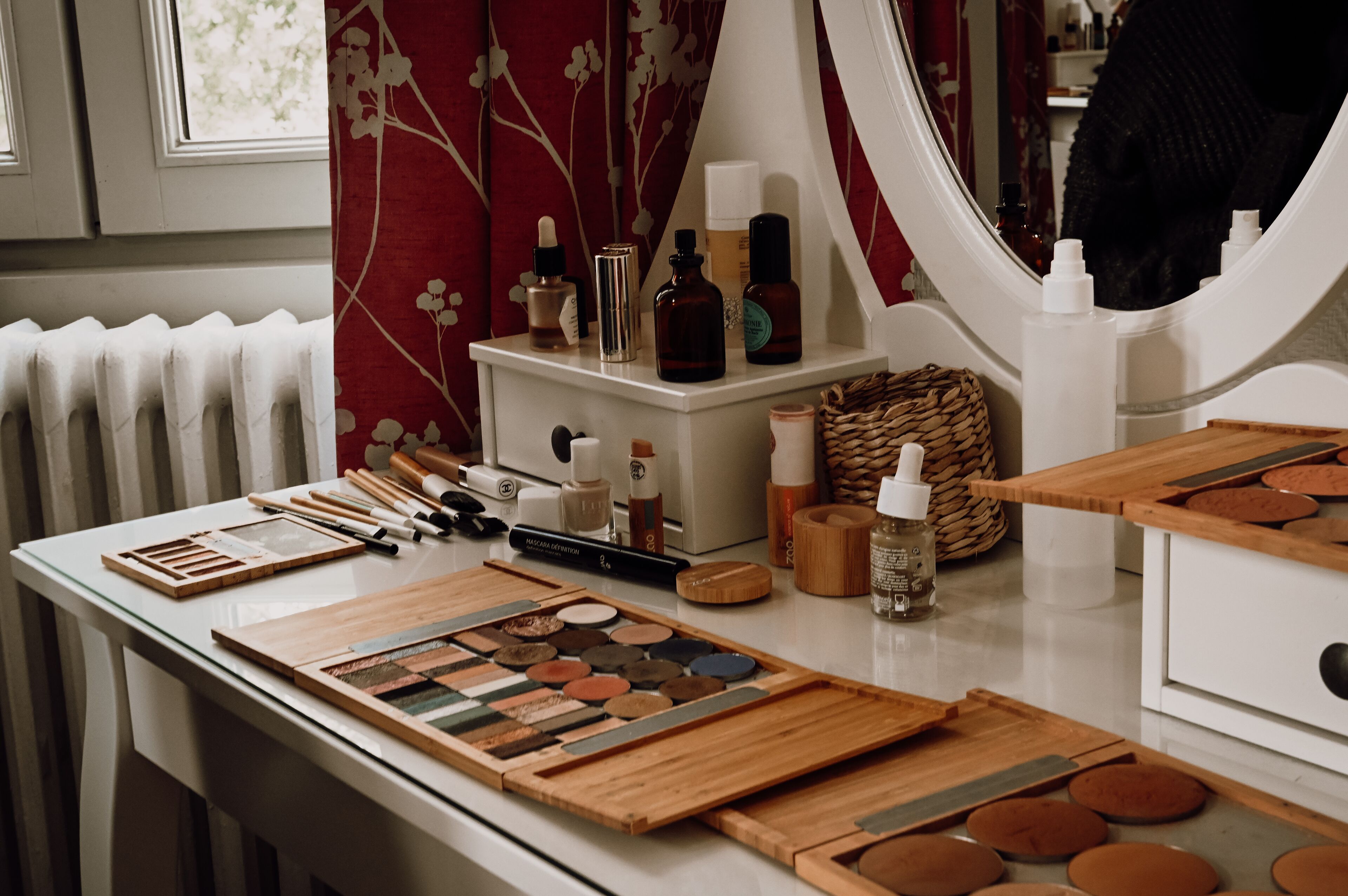 A makeup station with various products and tools.