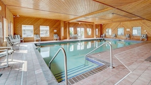 An indoor swimming pool with wooden walls and tiled flooring. - Brown Family Condo - Top Floor Views - Boat Slip (Wisconsin Dells)
