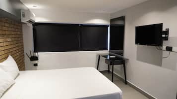 Estudio ejecutivo, 1 cama de matrimonio, cocina básica, vistas a la ciudad | Minibar, wifi gratis, ropa de cama
