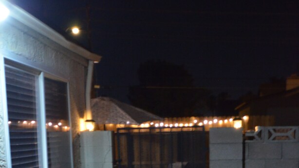A paved pathway leading to a gated area with string lights. - 9min to the airport washer & dryer, kitchen, outdoor BBQ. Sleeps 4 (Las Vegas)