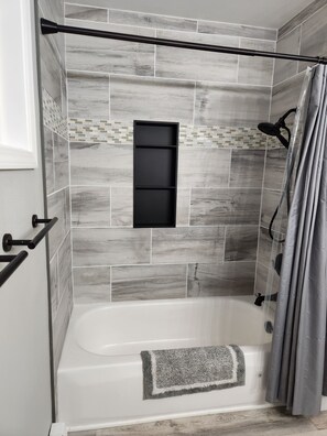 Combined shower/tub, hair dryer, towels, soap