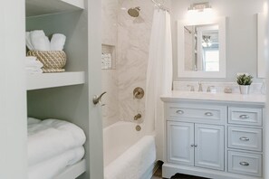 Combined shower/tub, hair dryer, towels, soap