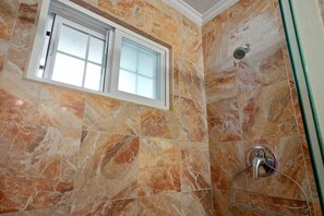 Shower, hair dryer, towels, shampoo