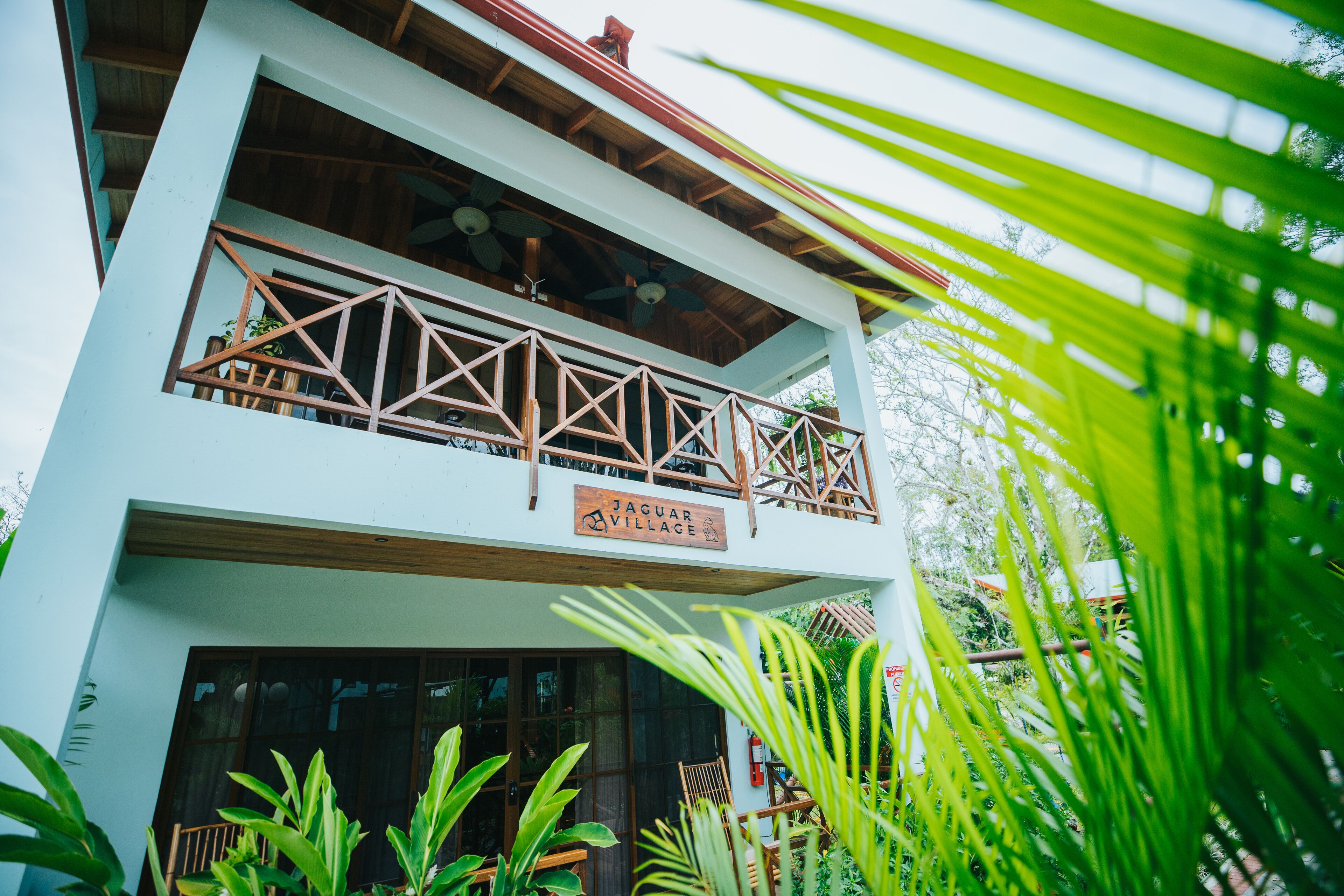 A two-story building with a sign reading "Jaguar Village."