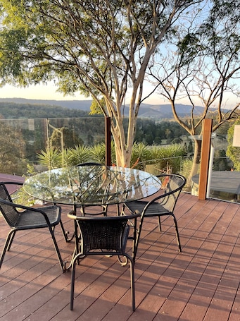 Outdoor dining. The Hilltop Hideaway, has stunning views from the hot tub or deck.