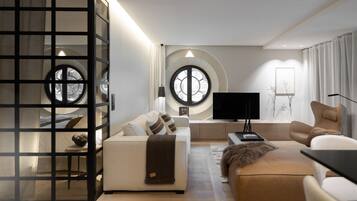 Appartement Élite | Coin séjour | TV connectée de 52 pouces avec chaînes par câble, télévision