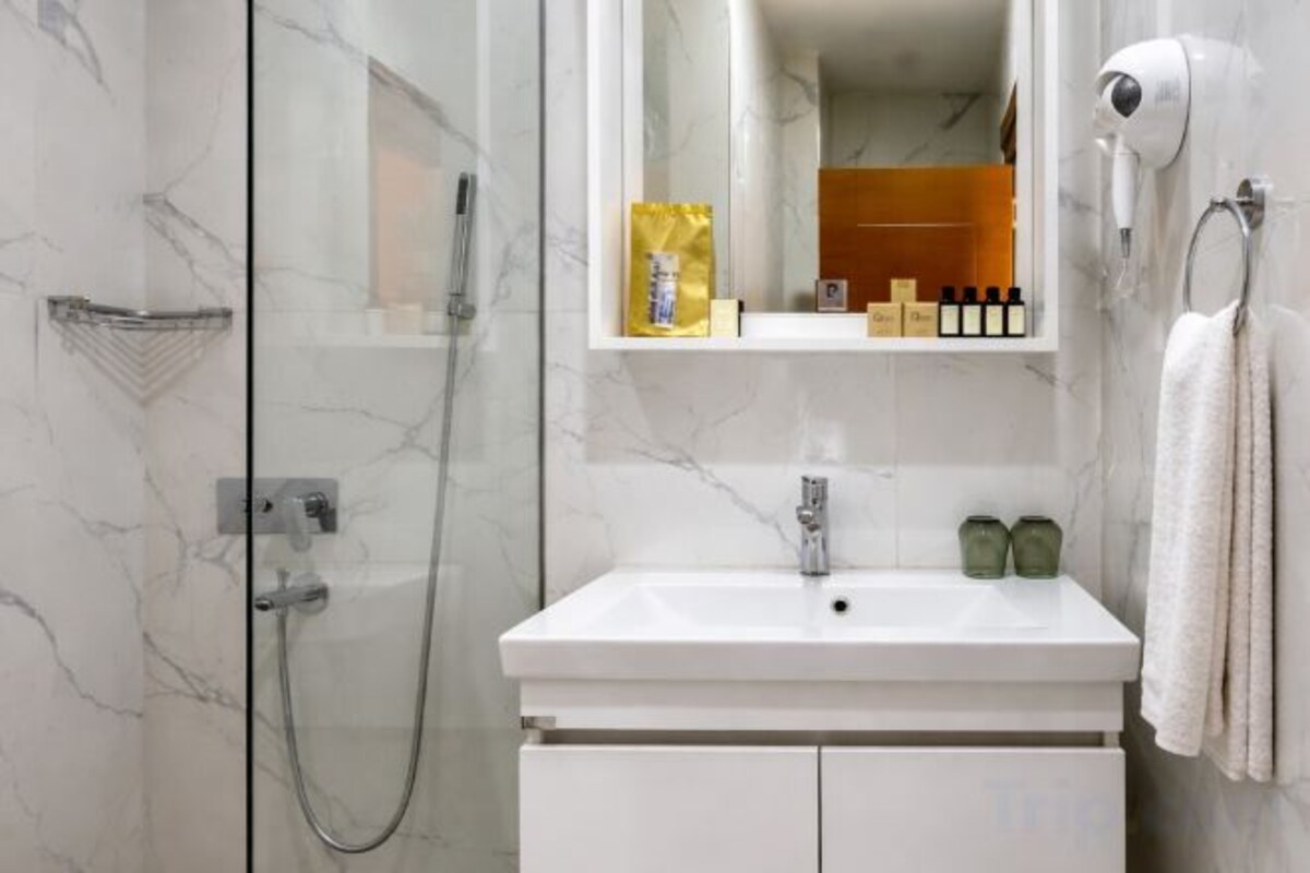 Bathroom | Shower, rainfall showerhead, hair dryer, slippers