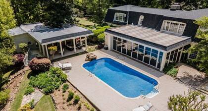 Spacious 5BR estate with Jacuzzi, pool, patio, and full kitchen.