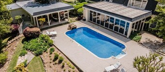 Spacious 5BR estate with Jacuzzi, pool, patio, and full kitchen.