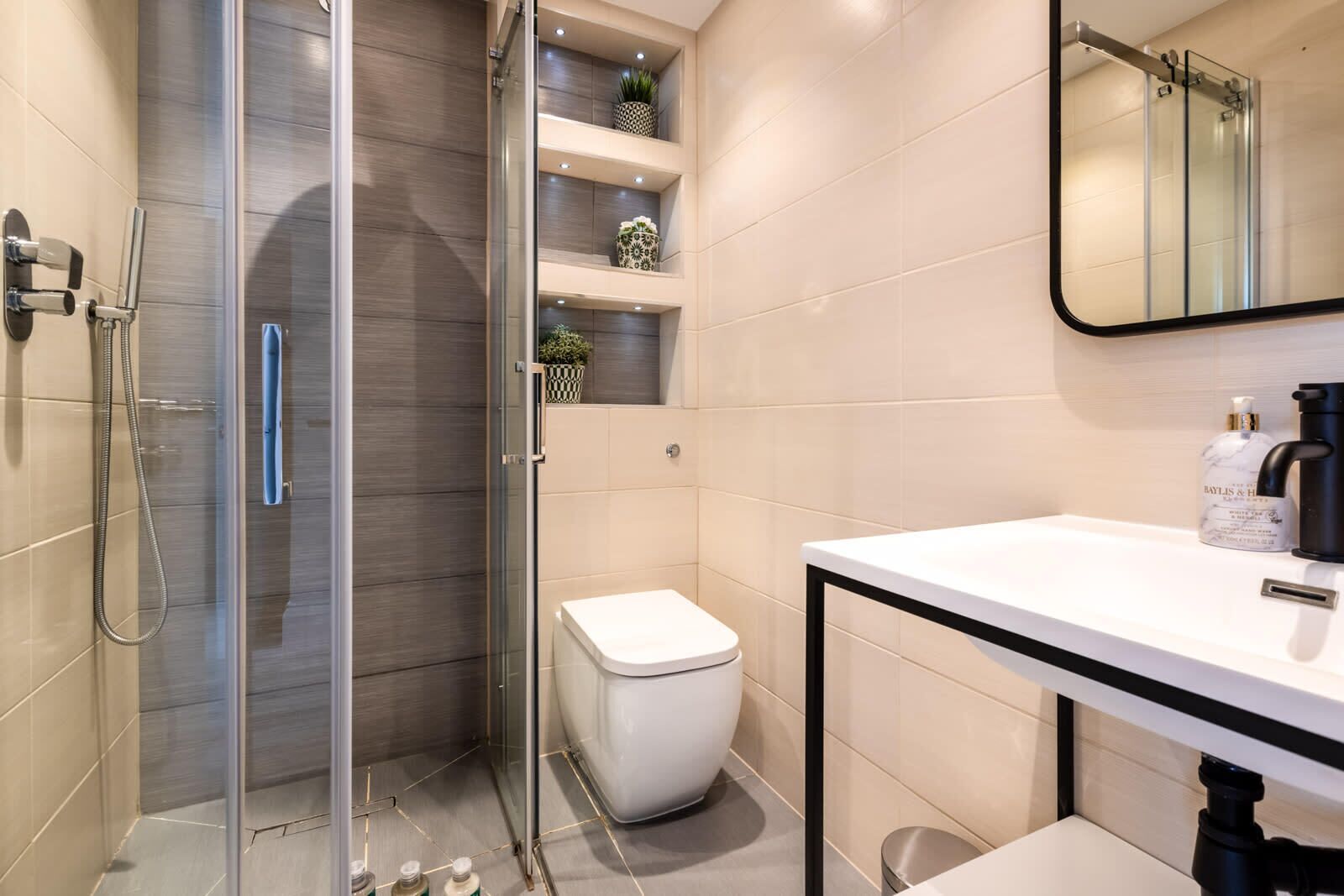Shower, hair dryer, towels, shampoo