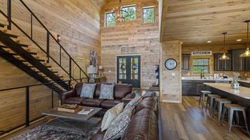 Cabin, 5 Bedrooms | Living room | 65-inch Smart TV with cable channels