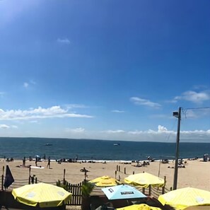 Relax on the beach with ocean views, sun loungers, and umbrellas.