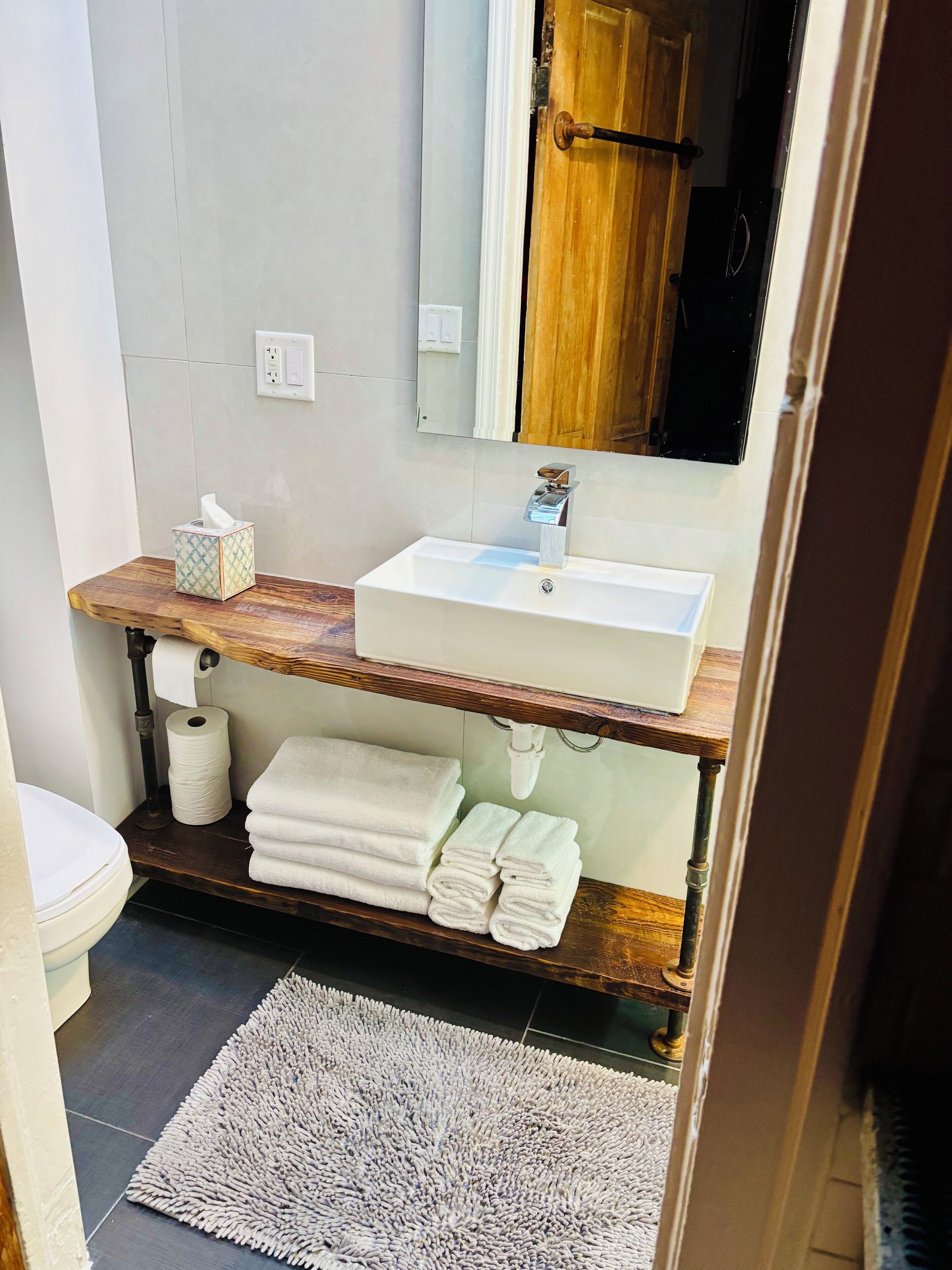 Combined shower/tub, hair dryer, towels, soap