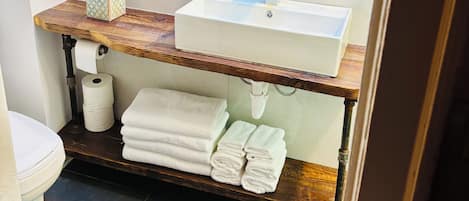 Combined shower/tub, hair dryer, towels, soap