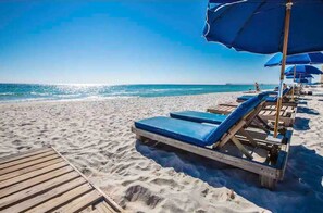 On the beach, sun loungers, beach towels