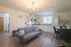 Apartment, 1 Bedroom | Living area | 55-inch Smart TV with digital channels, TV