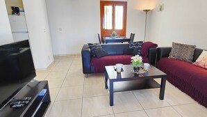 A living room with a sofa, a coffee table, and a TV. - AP346 TORROX BEACH (Torrox Costa)