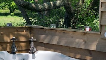 Bathtub, towels, soap, toilet paper