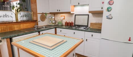 Fridge, dishwasher, electric kettle, cookware/dishes/utensils