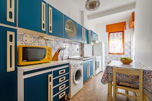 Fridge, microwave, stovetop, cookware/dishes/utensils