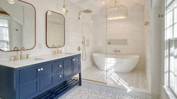 Bathtub, hair dryer, towels, soap