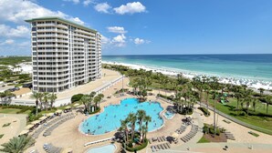 A hotel with a large pool area, beach access, and a view of the ocean. - Luxury Living from the 9th Floor of Silver Shells (Destin)