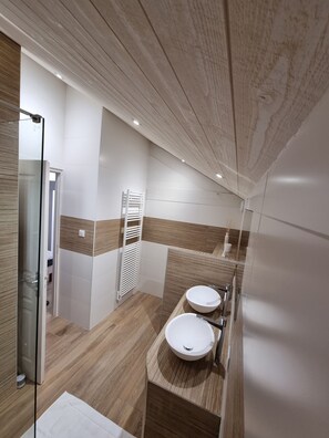 Bathtub, hair dryer, towels, soap