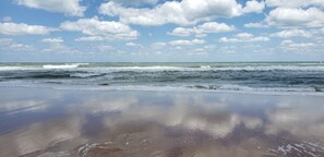 A beach with waves and a clear sky. - 3BR/2BA Oceanfront retreat for 6. Spacious, updated, pool,beach & ocean views. (Ormond Beach)