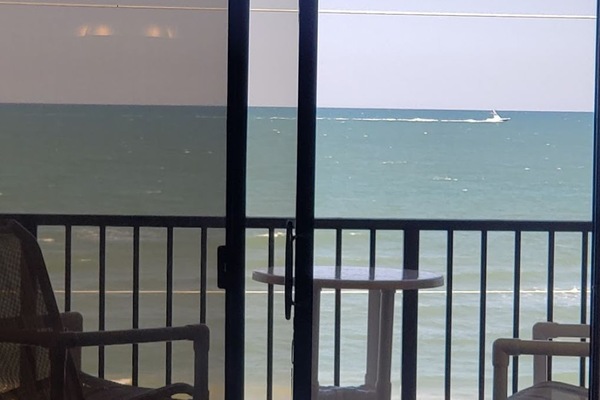 View of ocean from living room, primary and secondary bedroom.
