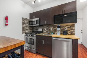 Standard Apartment, 1 Queen Bed with Sofa bed, Non Smoking (Suite Seven) | Private kitchen | Full-size fridge, microwave, oven, stovetop