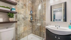 Combined shower/tub, hair dryer, towels, soap